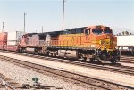 Eastbound stack train cruises past the station